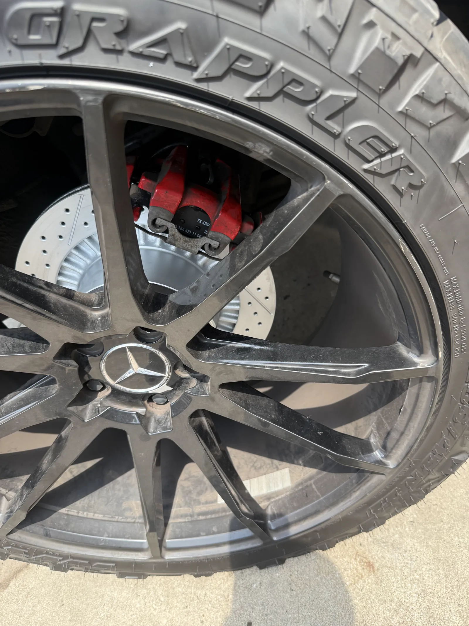 Alloy wheel being repaired and refinished at Mentor Auto Service in Nashville.