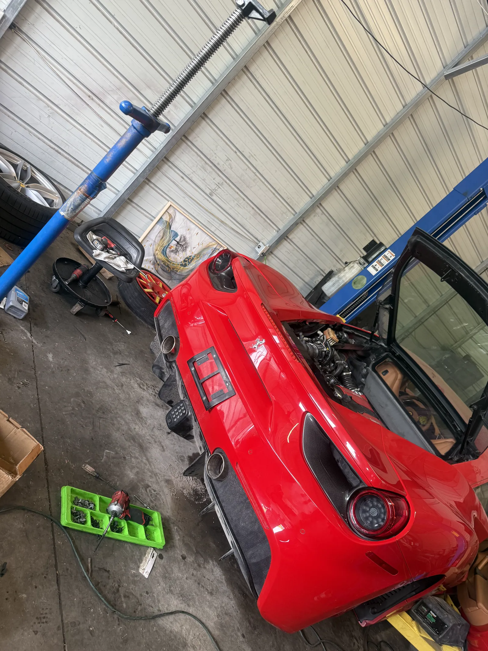 Engine bay work on a European vehicle at Mentor Auto Service.